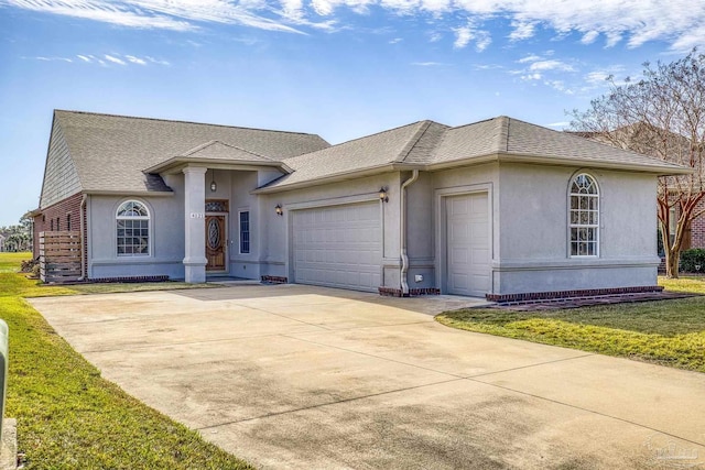 view of front of property with a front lawn and a garage