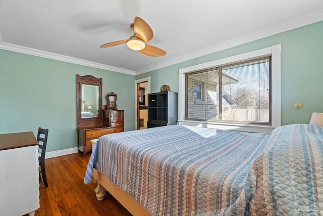 bedroom with ceiling fan, dark hardwood / wood-style floors, and ornamental molding