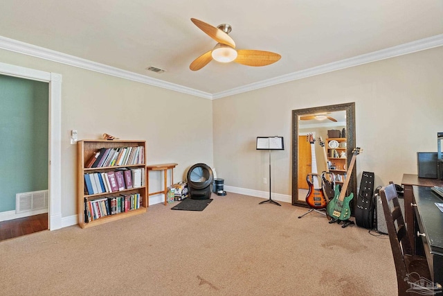 misc room with ceiling fan, crown molding, and light colored carpet