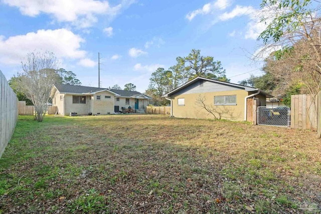 rear view of house with a lawn