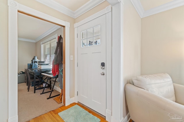 entrance foyer with plenty of natural light, light hardwood / wood-style flooring, and crown molding