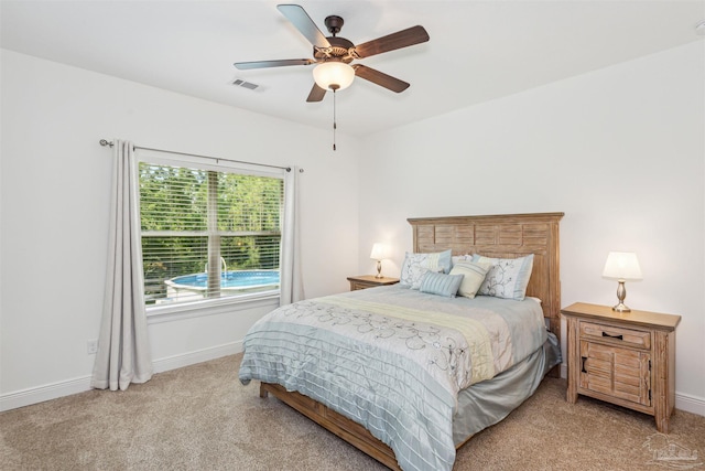 carpeted bedroom with ceiling fan