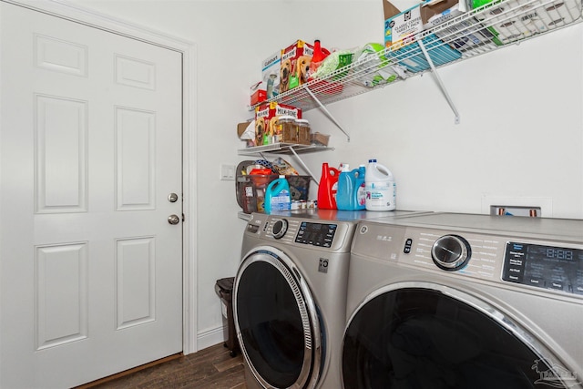 washroom with dark hardwood / wood-style flooring and washer and clothes dryer