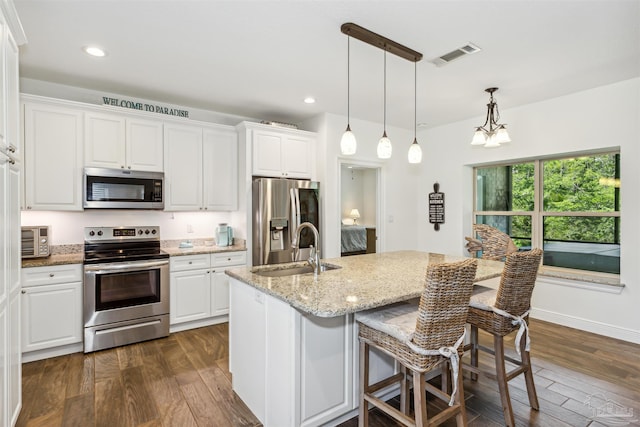 kitchen with stainless steel appliances, dark hardwood / wood-style floors, white cabinetry, and sink