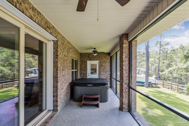 sunroom featuring ceiling fan