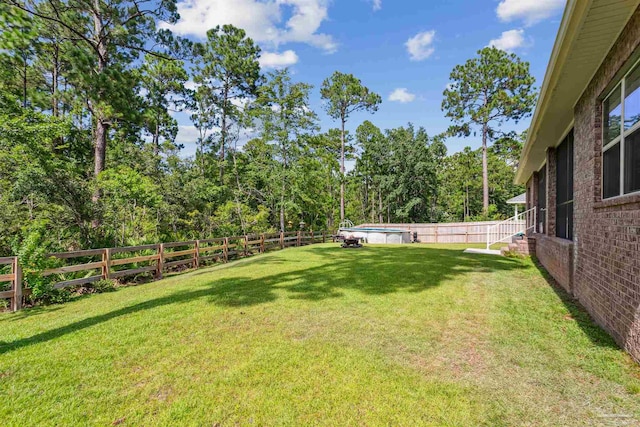 view of yard with a pool