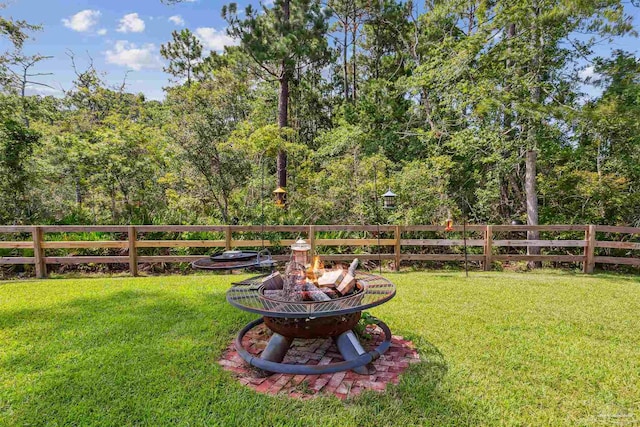 view of yard featuring a fire pit