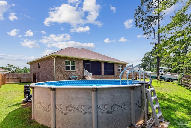 view of pool with a yard