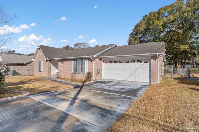 ranch-style home with a garage and a front yard