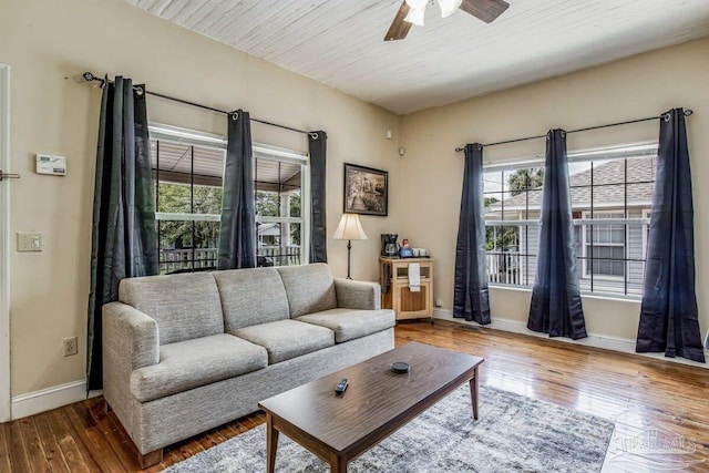 living room featuring hardwood / wood-style flooring and ceiling fan