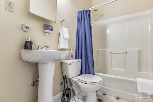 full bathroom featuring shower / bath combination with curtain, toilet, sink, and tile patterned floors