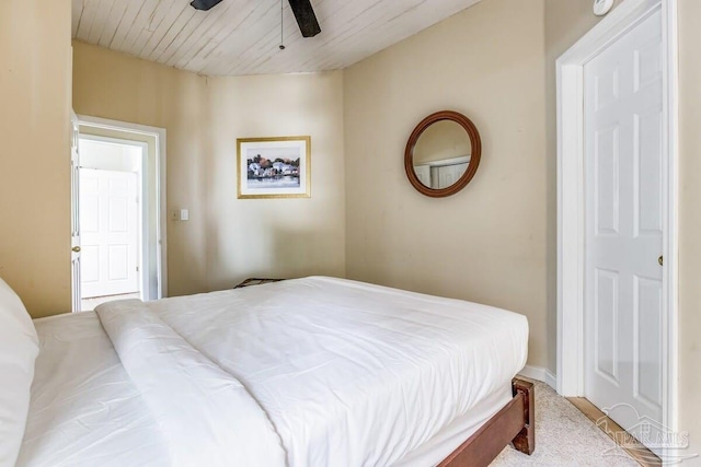 carpeted bedroom featuring ceiling fan and wooden ceiling