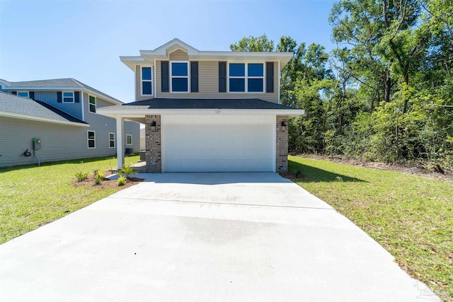 view of front of home featuring a front yard and a garage