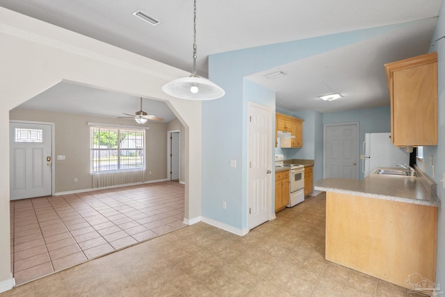 kitchen with visible vents, light brown cabinetry, a sink, under cabinet range hood, and white appliances