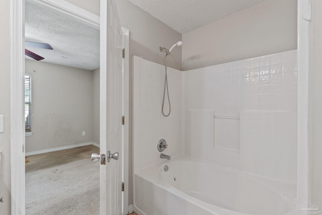 full bathroom featuring shower / tub combination, a textured ceiling, ceiling fan, and baseboards
