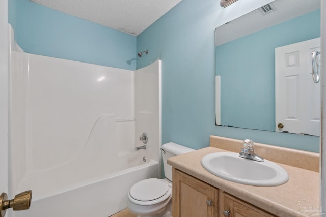 bathroom with visible vents, vanity, toilet, a textured ceiling, and shower / bath combination