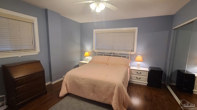 bedroom with ceiling fan, a closet, baseboards, and wood finished floors