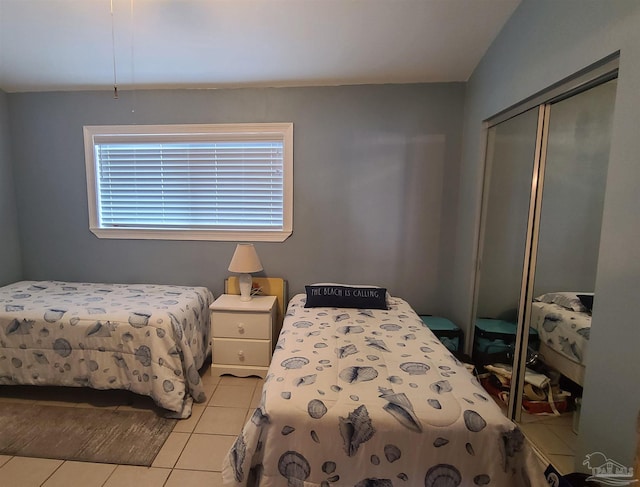 bedroom featuring a closet and light tile patterned flooring