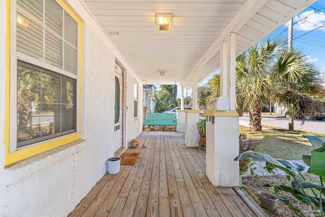 wooden terrace featuring a porch