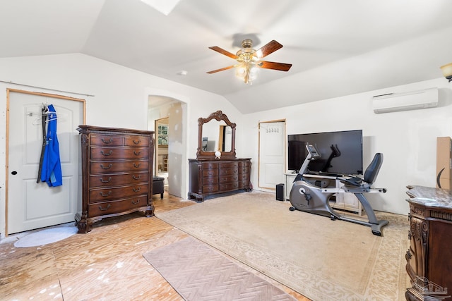 bedroom with lofted ceiling, an AC wall unit, and ceiling fan