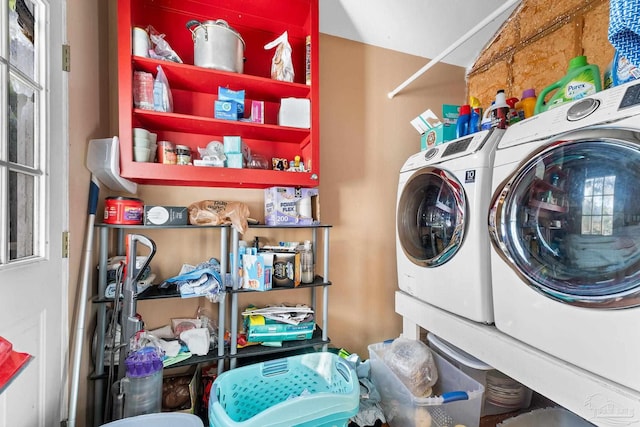 laundry room featuring washing machine and clothes dryer