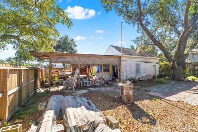 back of house with a patio area