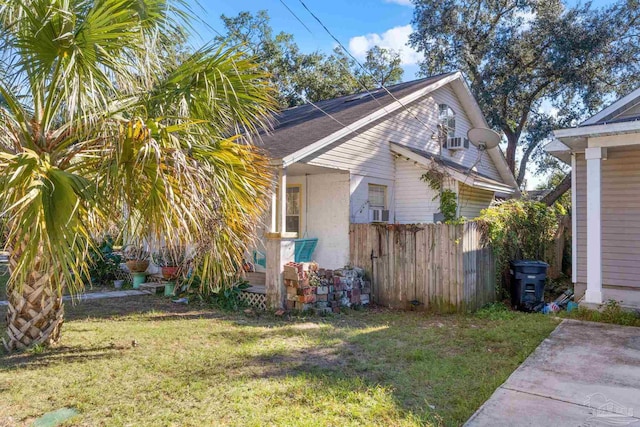 view of property exterior featuring a lawn