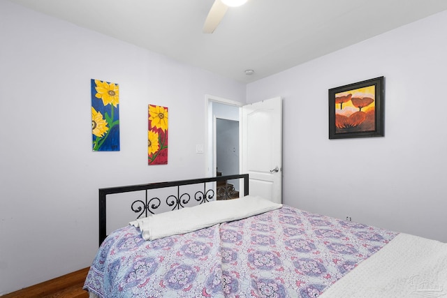 bedroom with wood-type flooring and ceiling fan