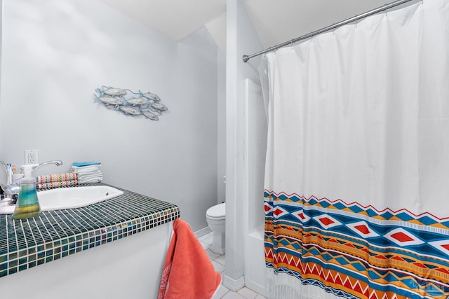 full bathroom featuring sink, toilet, tile patterned floors, and shower / bath combination with curtain