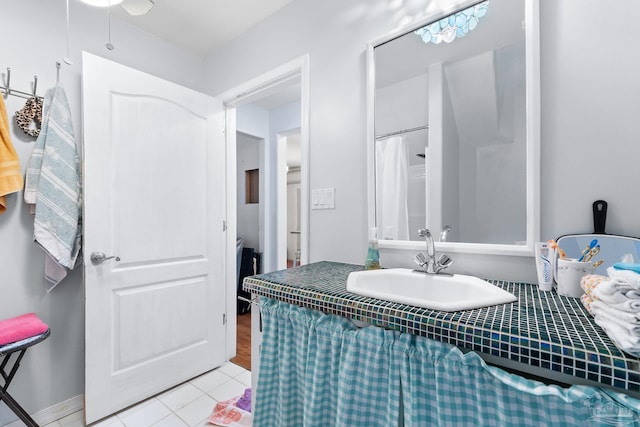 bathroom featuring tile patterned flooring and vanity