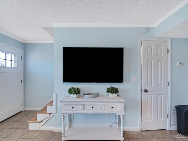 living room with ornamental molding, a textured ceiling, and light tile patterned flooring