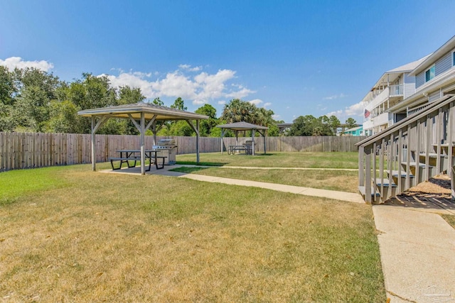 view of yard featuring a gazebo and a patio area