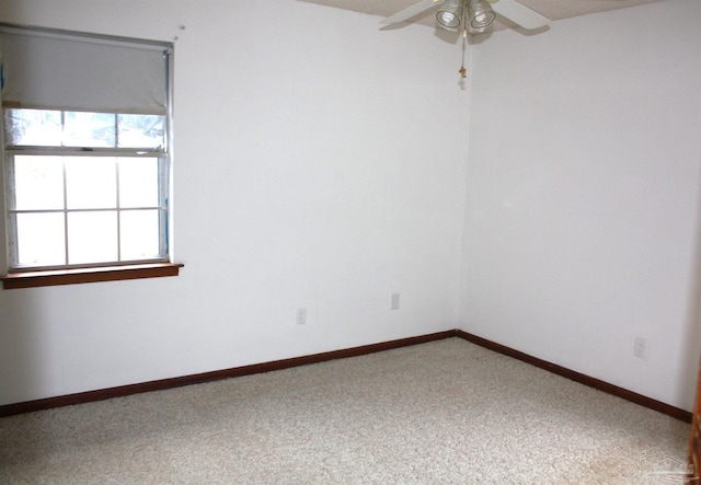 carpeted empty room with ceiling fan