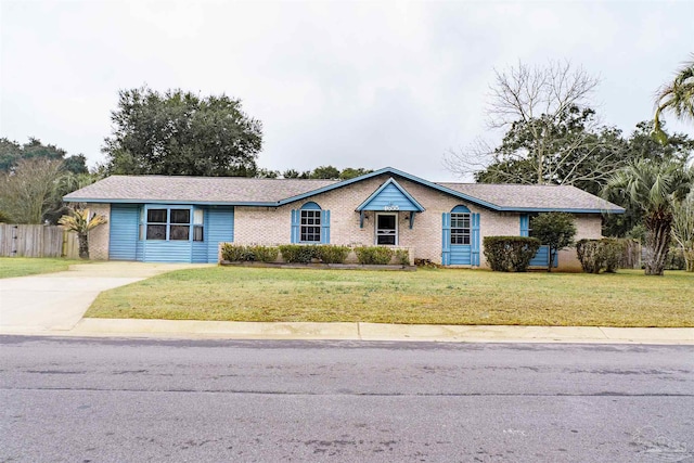 ranch-style home featuring a front yard