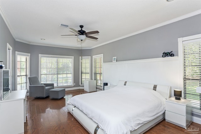 bedroom with crown molding, dark wood-style floors, and visible vents