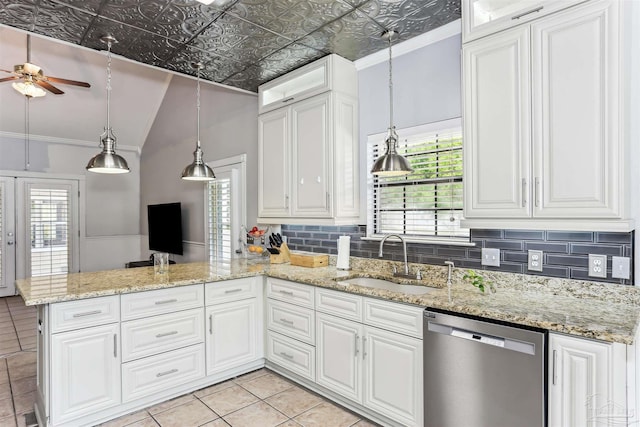 kitchen featuring stainless steel dishwasher, a sink, a peninsula, and white cabinets