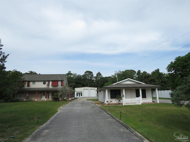view of front facade featuring a garage, a porch, and a front yard