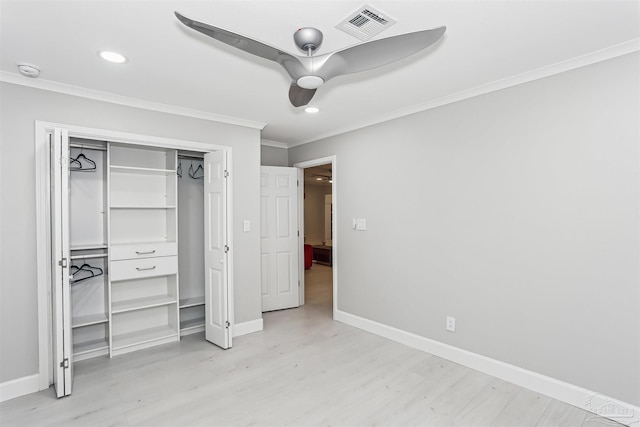 unfurnished bedroom with crown molding, light wood-style flooring, recessed lighting, baseboards, and visible vents