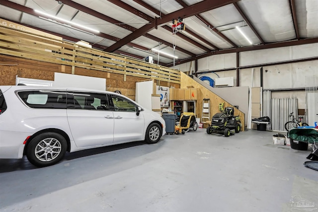 garage featuring wood walls