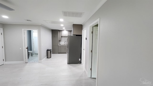 hall featuring crown molding, recessed lighting, visible vents, and attic access