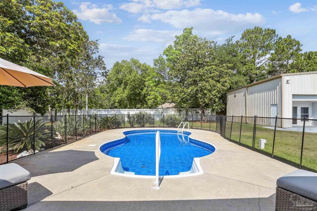view of swimming pool with a fenced in pool, fence, and a patio