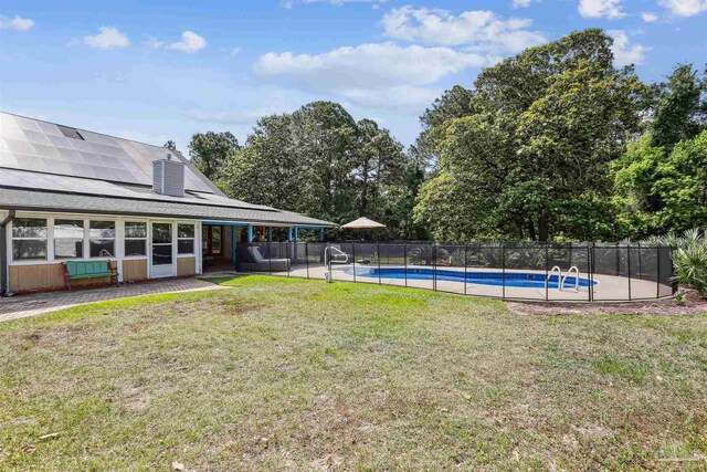 view of yard with a fenced in pool, a patio area, and fence