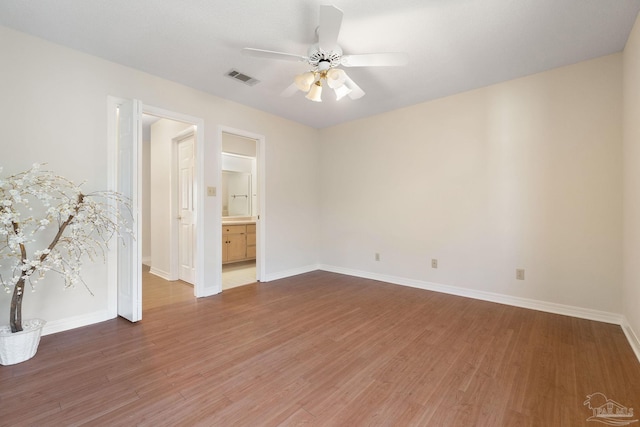 empty room featuring dark hardwood / wood-style floors and ceiling fan