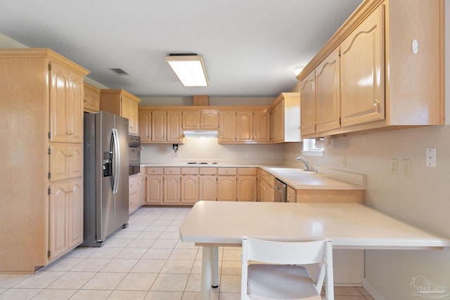 kitchen with a kitchen breakfast bar, sink, light brown cabinetry, appliances with stainless steel finishes, and kitchen peninsula