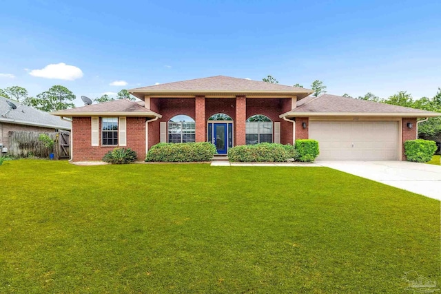 11532 Aruba Dr, Pensacola, FL 32506 - view of front of property featuring an attached garage, a front lawn, brick siding, and concrete driveway