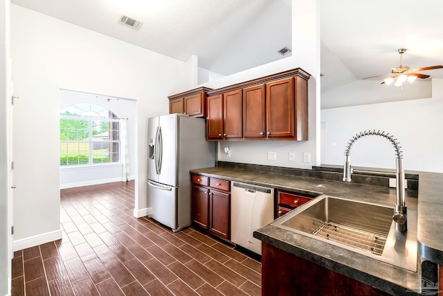 11532 Aruba Dr, Pensacola, FL 32506 - kitchen with visible vents, dark countertops, ceiling fan, a sink, and stainless steel appliances