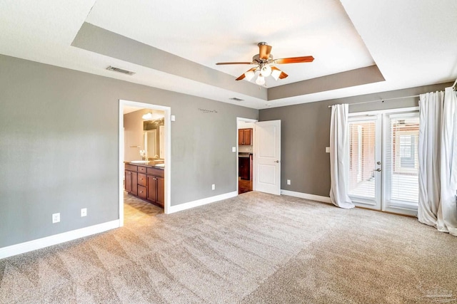 11532 Aruba Dr, Pensacola, FL 32506 - unfurnished bedroom featuring access to outside, baseboards, light carpet, and a tray ceiling