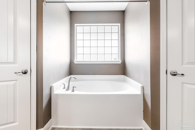 11532 Aruba Dr, Pensacola, FL 32506 - full bath featuring baseboards, a textured wall, and a garden tub