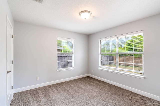 11532 Aruba Dr, Pensacola, FL 32506 - unfurnished room with baseboards, carpet flooring, and a textured ceiling