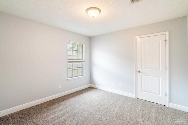 11532 Aruba Dr, Pensacola, FL 32506 - unfurnished room featuring baseboards, a textured ceiling, and carpet